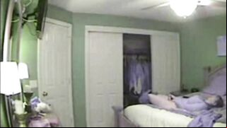 Hidden camera caught chubby housewife masturbating in the bedroom