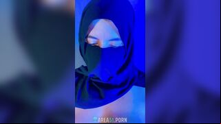 Muslim mistress wife in hijab putting a condom on big strapon