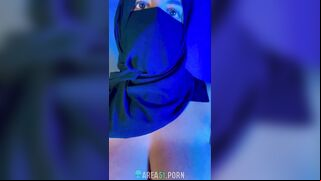 Muslim mistress wife in hijab putting a condom on big strapon