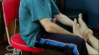 Ass-fucking teen gets spanked and fingered until she cums, featuring hot foot play and sock-covered feet.