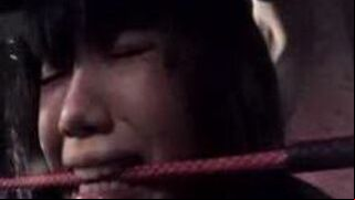 Young Asian woman receives intense spanking punishment.