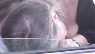 Caught on camera a woman giving blowjob to a stranger in car